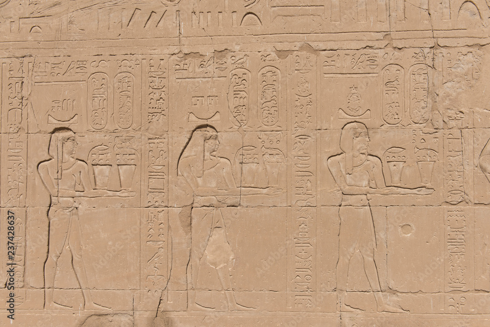 Hieroglyphic carvings on an ancient egyptian temple wall Hieroglyphic carvings on an ancient egyptian temple wall
