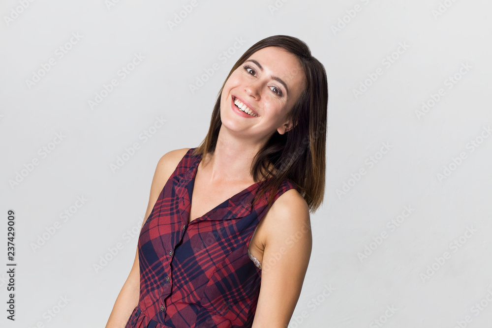 Amazing and cheerful smiling brunette woman in beautiful dress studio shot, isolated on white Amazing and cheerful smiling brunette woman in beautiful dress studio shot, isolated on white