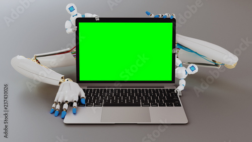 Robot hands with small robots behind a laptop pc. Green screen template. 