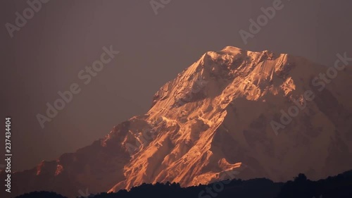 Snow Peak of Dhaulagiri Mountain at Sunrise in the Himalayas in Nepal photo