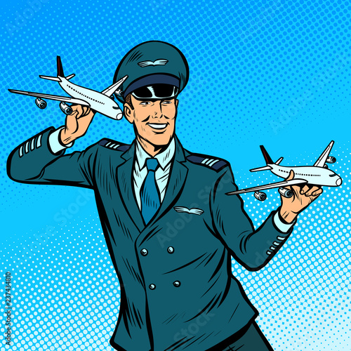male airplane pilot. Model aircraft in hand