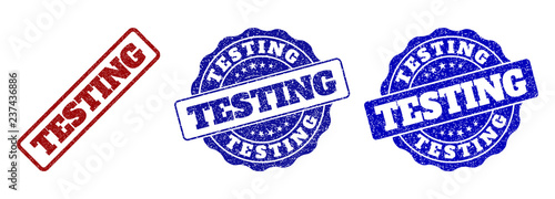 TESTING scratched stamp seals in red and blue colors. Vector TESTING watermarks with grainy effect. Graphic elements are rounded rectangles, rosettes, circles and text captions.
