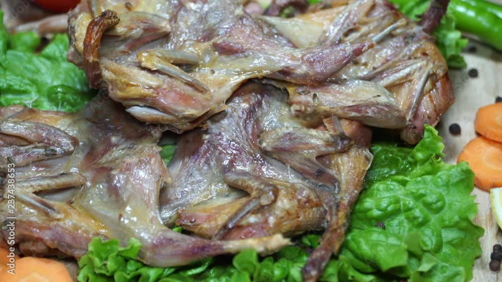 The delicious fried quails served with vegetables. Winterly protein quails. 4K The delicious fried quails served with vegetables. Winterly protein quails. 4K