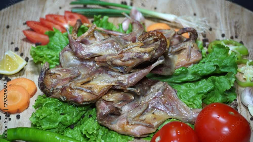 The delicious fried quails served with vegetables. Winterly protein quails. 4K The delicious fried quails served with vegetables. Winterly protein quails. 4K
