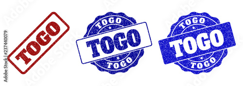 TOGO grunge stamp seals in red and blue colors. Vector TOGO signs with grunge style. Graphic elements are rounded rectangles, rosettes, circles and text tags. Designed for rubber stamp imitations.