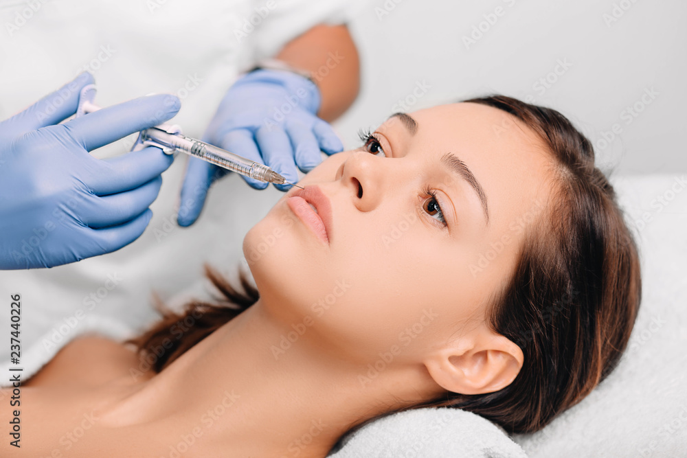 woman having lip injections, procedure lip augmentation woman having lip injections, procedure lip augmentation