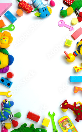 Baby toys frame. Colorful kids toys on white background. Copy space for text. Top view. Flat lay.