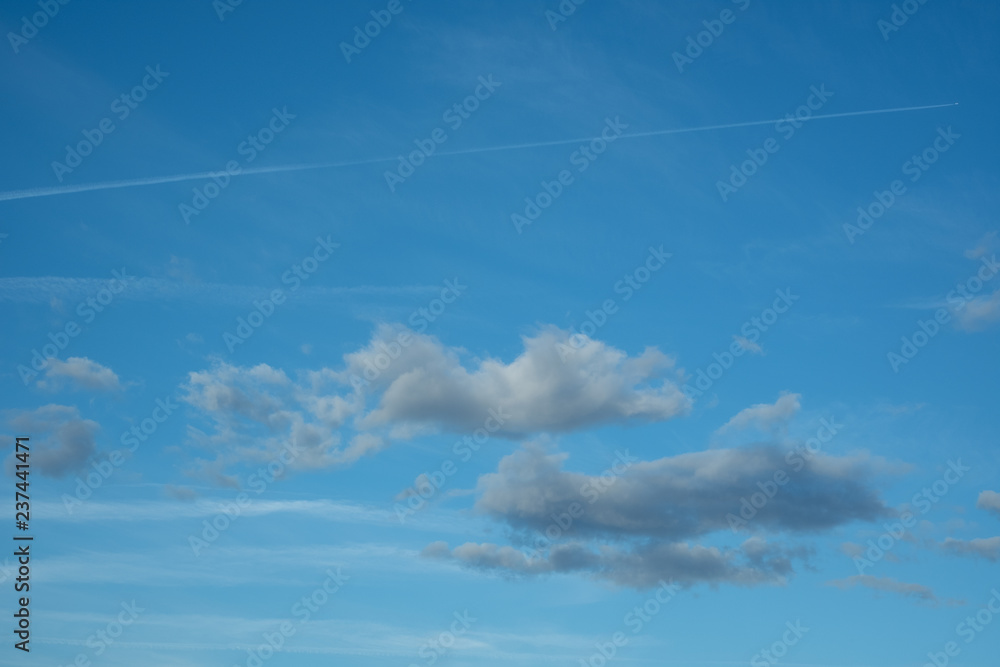 blue sky with light grey clouds blue sky with light grey clouds