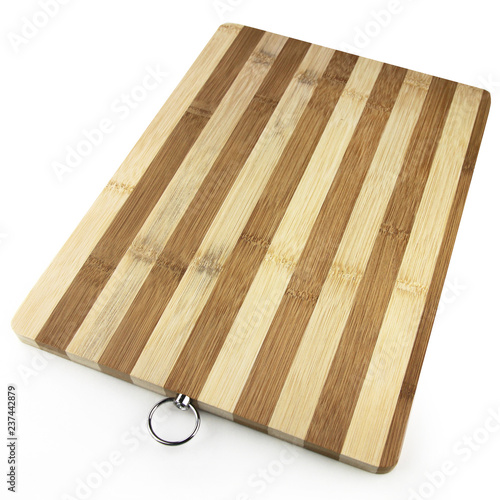 Wooden kitchen cutting empty board closeup photography on the white background. Kitchen tool board with stripes made of wood promotion photo. 
