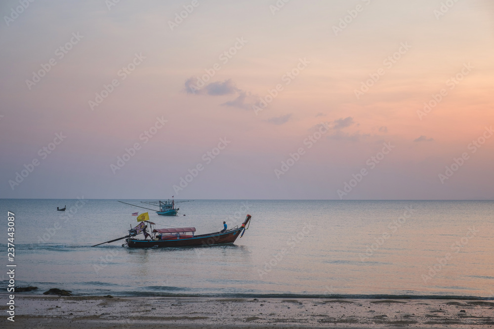 Evening seascape in Thailand with fishing boats