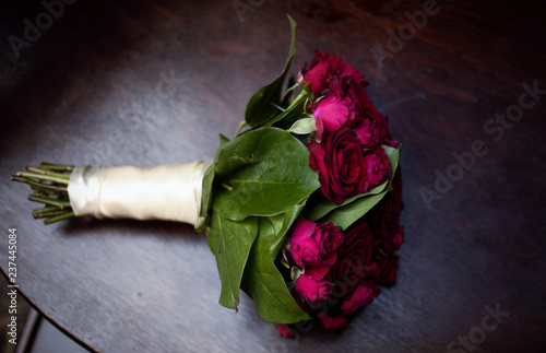 rose in vase on black background