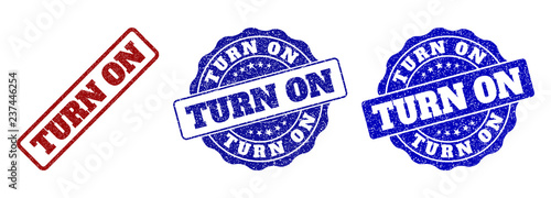 TURN ON grunge stamp seals in red and blue colors. Vector TURN ON marks with grunge surface. Graphic elements are rounded rectangles, rosettes, circles and text tags.