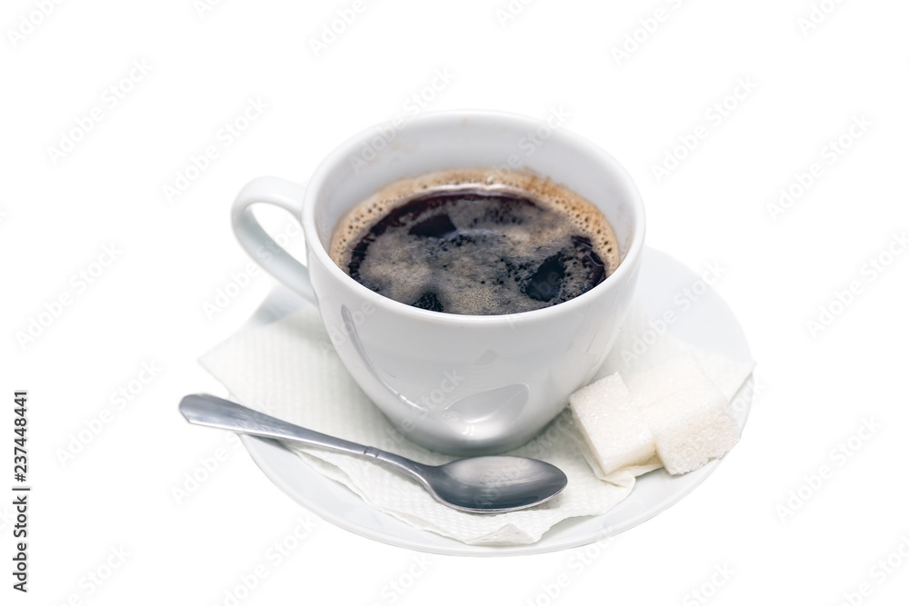Naklejka premium Cup of black coffee on a saucer with a napkin, a teaspoon and lumps of sugar