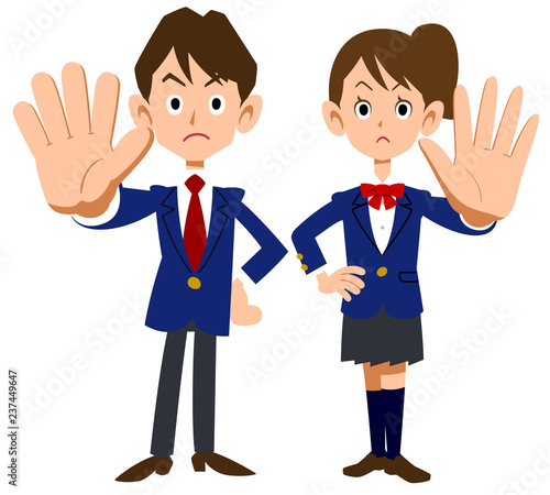 拒否のポーズをする学生服の男女
