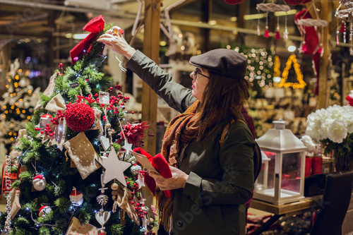 Woman choosing christmas decorations