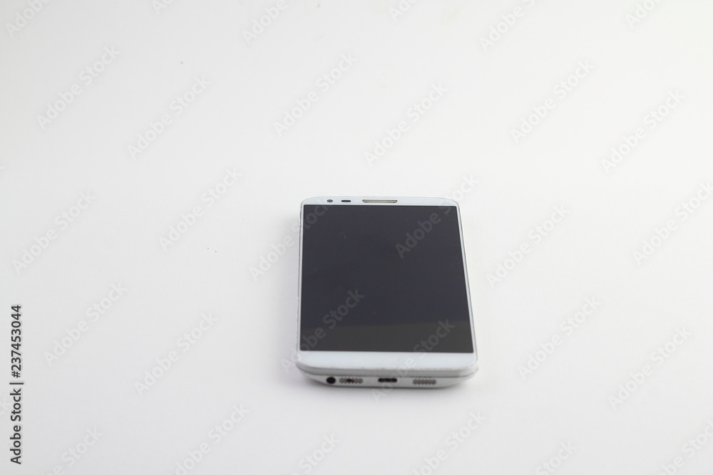 White mobile phone isolated on white background. White mobile phone isolated on white background.