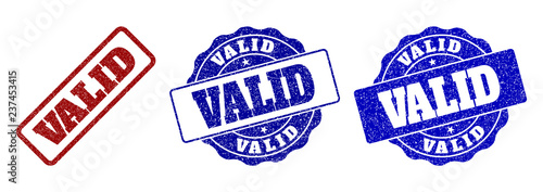 VALID grunge stamp seals in red and blue colors. Vector VALID labels with grainy surface. Graphic elements are rounded rectangles, rosettes, circles and text labels.