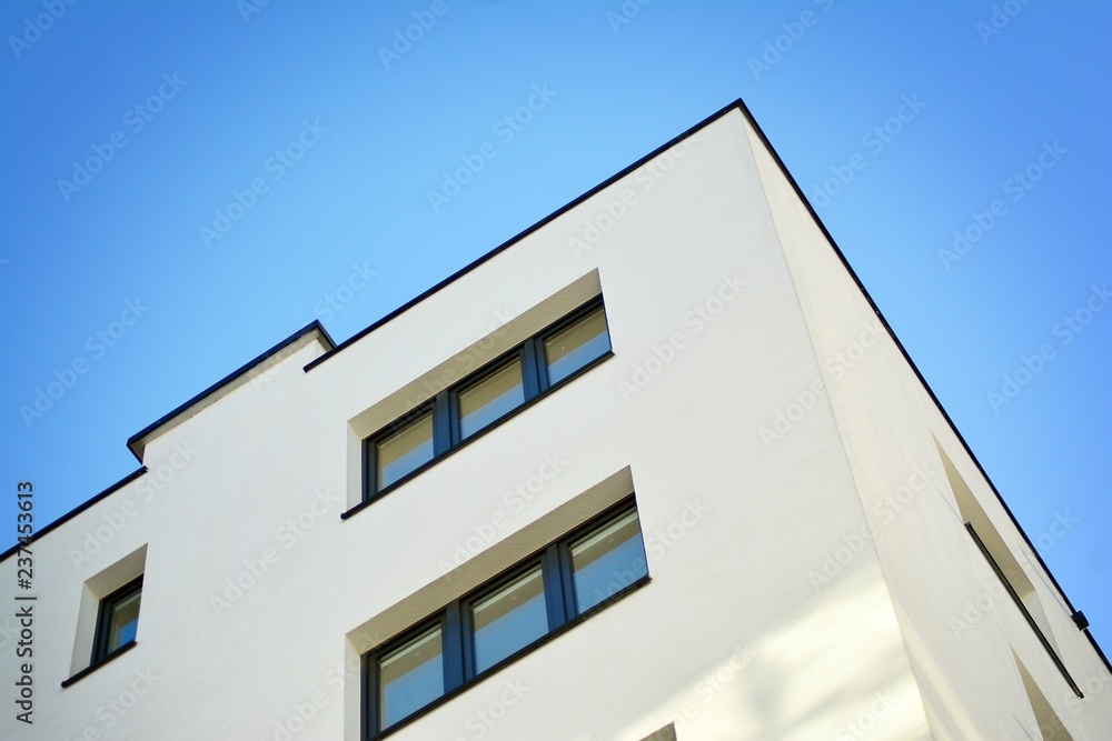 Modern apartment buildings on a sunny day with a blue sky. Facade of a modern apartment building