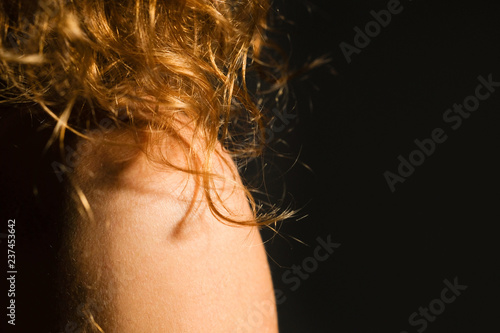 Natural curly red hair of a young woman