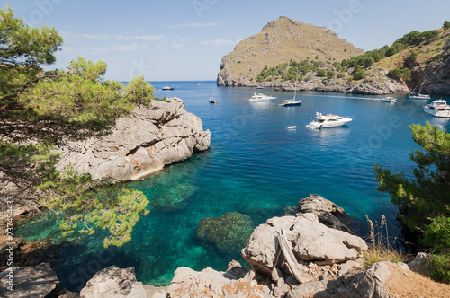 Puerto de Sa Calobra, Mallorca, Spain - July 20, 2013: View of yachts, rocks and bay