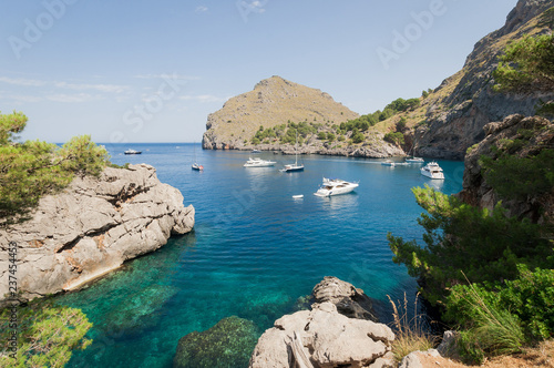 Puerto de Sa Calobra, Mallorca, Spain - July 20, 2013: View of yachts, rocks and bay © Nikolay Denisov
