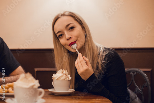 Blond girl with hot chocoloate cup