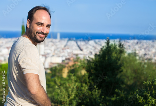 Man with a beard smiling in Barcelona