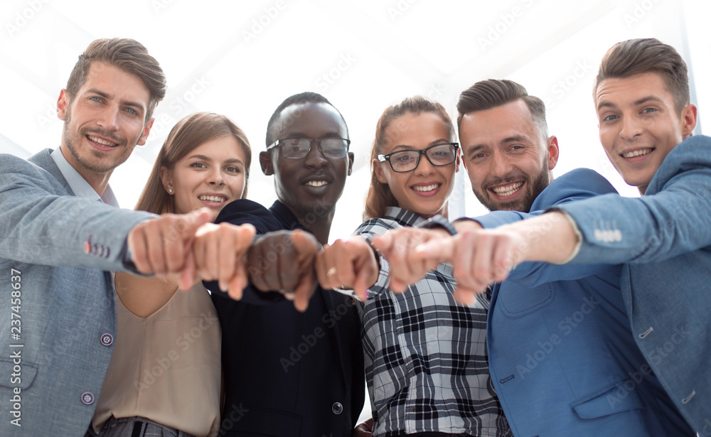 Portrait of excited young business people pointing at you Portrait of excited young business people pointing at you
