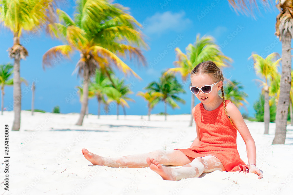 Beautiful little girl at beach having fun. Funny girl enjoy summer vacation.  Stock Photo | Adobe Stock