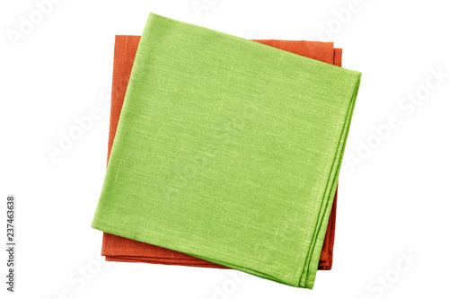 Stack of pale green and red folded napkins on white