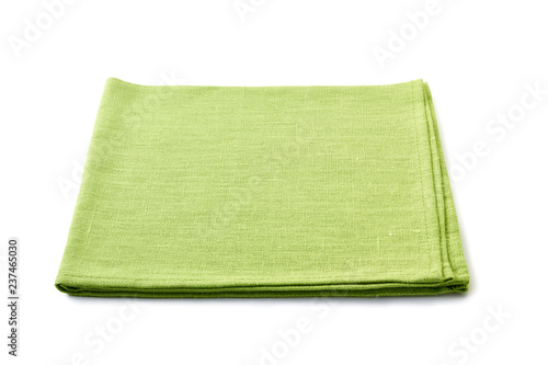 Pale green folded textile napkin on white