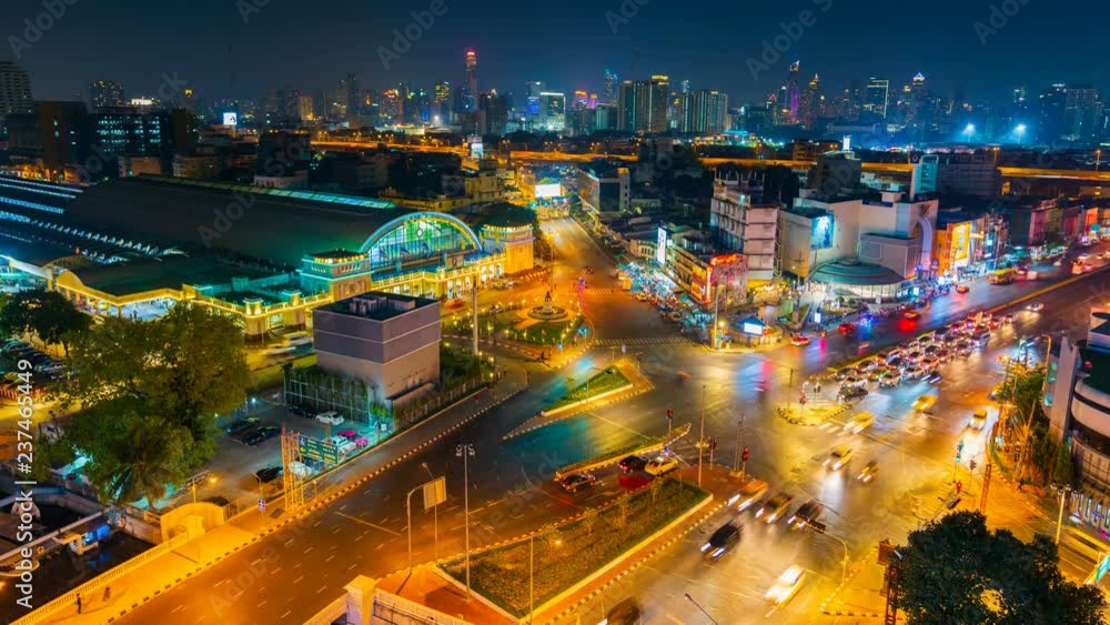 time lapse of traffic at Hua Lamphong intersection and Hua Lamphong railway station at night in Bangkok, Thailand time lapse of traffic at Hua Lamphong intersection and Hua Lamphong railway station at night in Bangkok, Thailand