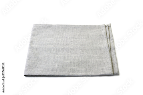 Folded pale gray textile napkin on white
