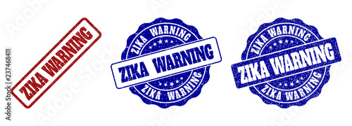 ZIKA WARNING grunge stamp seals in red and blue colors. Vector ZIKA WARNING signs with grunge effect. Graphic elements are rounded rectangles, rosettes, circles and text tags.