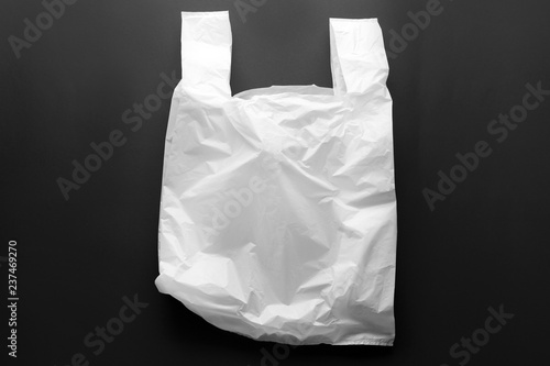 Clear disposable plastic bag on black background