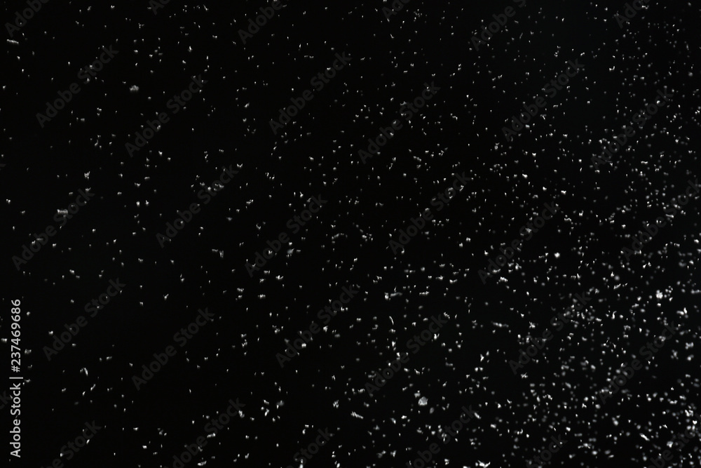 Snow flakes falling on black background. Winter weather Snow flakes falling on black background. Winter weather