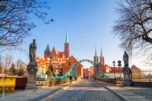 View of the pedestrian Tumski Bridge (is also called Lovers Bridge, Cathedral Bridge or Green Bridge), adorned with many love locks and hearts, Wroclaw, the Poland