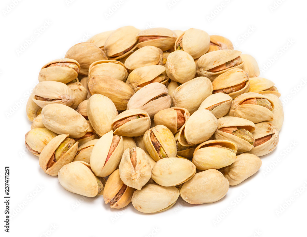 Handful of pistachio nuts (Pistacia vera) in the shell, close up, isolated on white background Handful of pistachio nuts (Pistacia vera) in the shell, close up, isolated on white background