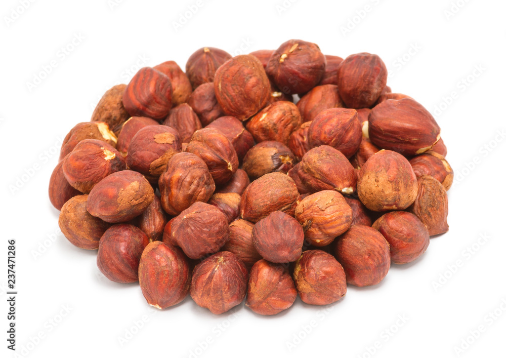 Handful of peeled ripe hazelnuts closeup, isolated on white background Handful of peeled ripe hazelnuts closeup, isolated on white background