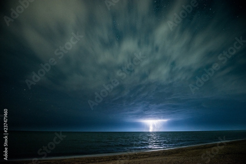Night thunderstorm with lightning above the sea © MIRACLE MOMENTS