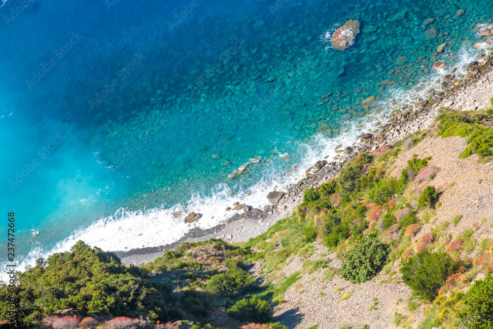 Rocks in the blue Mediterranean Sea on a bright sunny day. Rocks in the blue Mediterranean Sea on a bright sunny day.