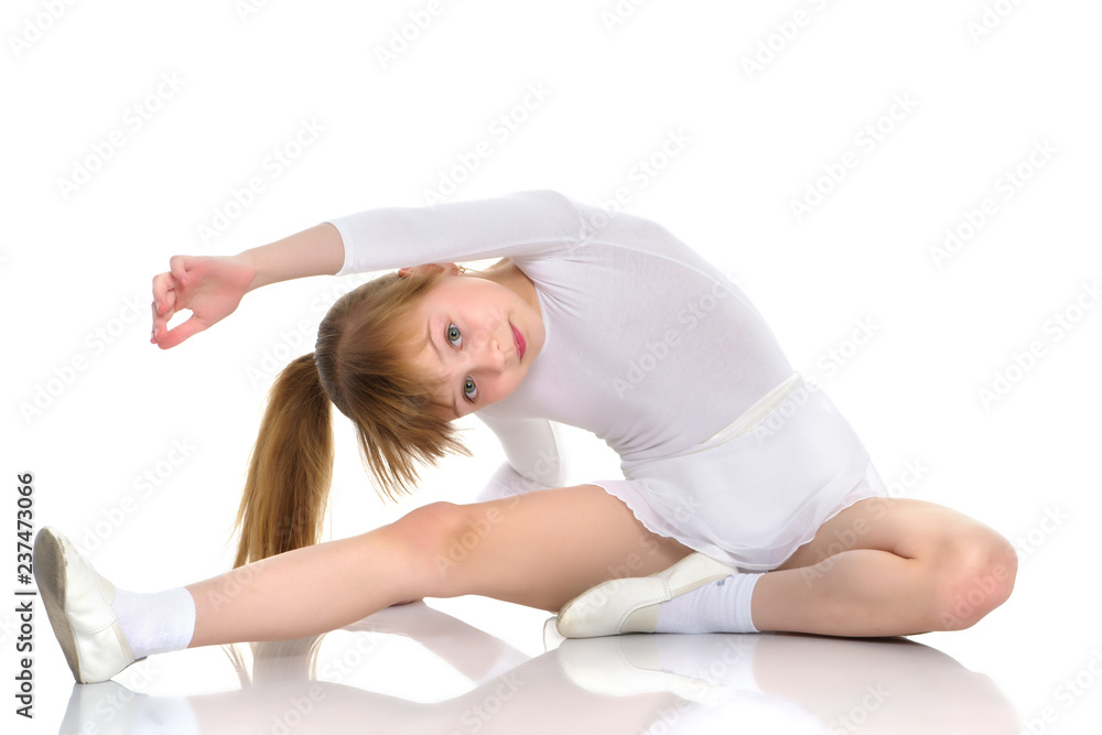 The gymnast perform an acrobatic element on the floor. The gymnast perform an acrobatic element on the floor.