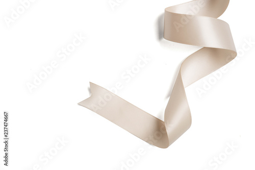 cream ribbon in roll on white