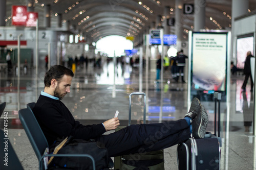 Passenger checking boarding pass