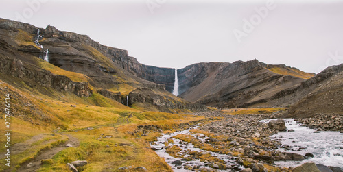 Fototapeta Naklejka Na Ścianę i Meble -  Panoramic photos of famous Icelandic waterfalls on cloudy days with geological formations.