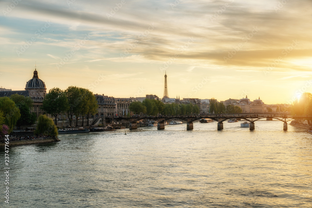 Seine river and Pont des Arts bridge in suset at Paris, France.