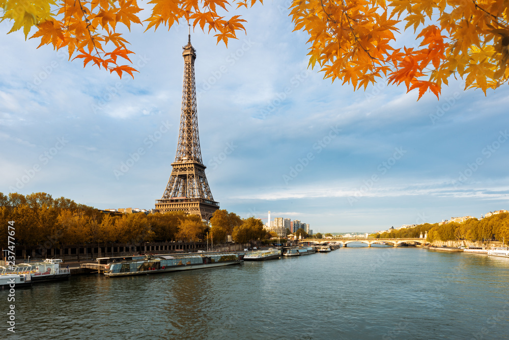 Seine in Paris with Eiffel tower in autumn season in Paris, France.