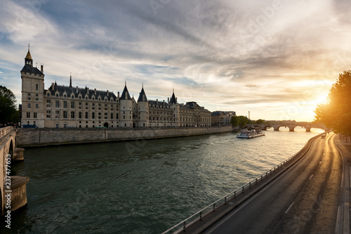 Boat tour on Seine river in Paris with sunset. Paris, France.