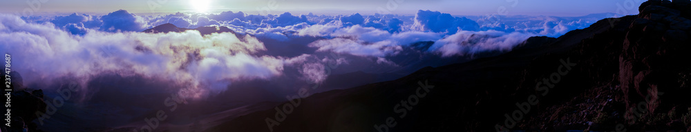 Clouds at sunrise over Haleakala Crater, Maui, Hawaii, USA