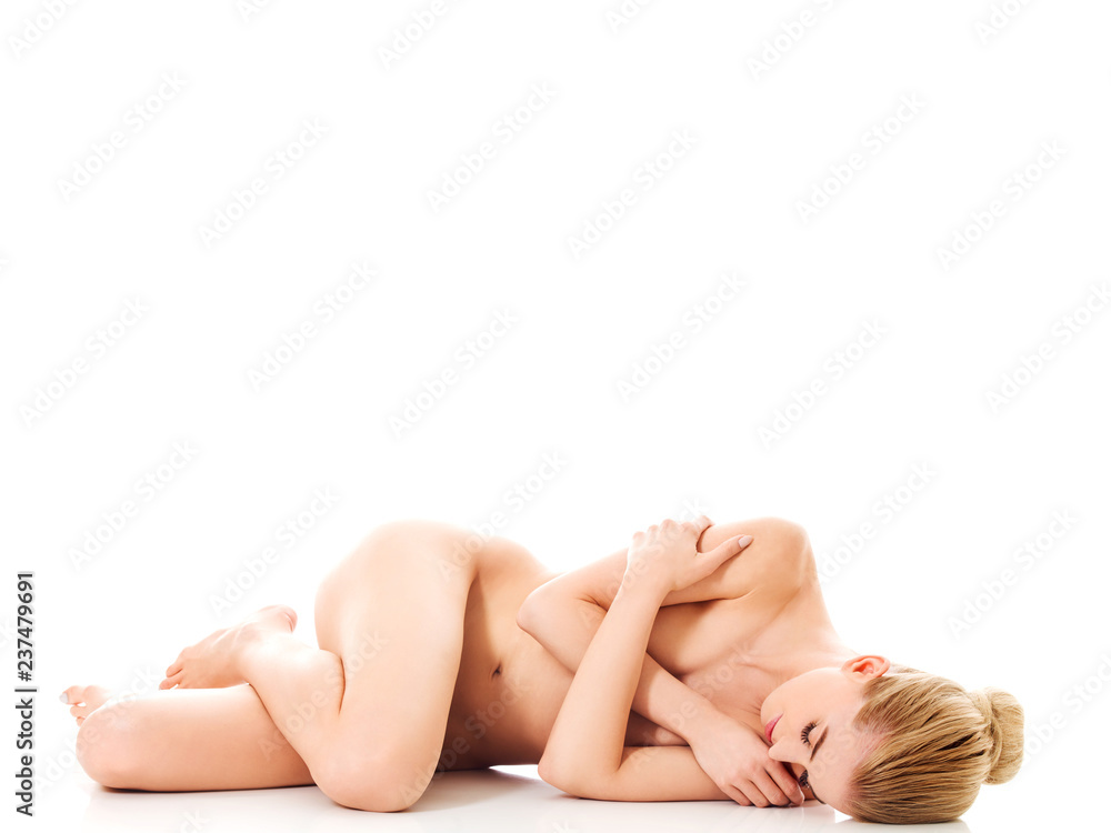 Fototapeta premium Beautiful nude woman lieing on flor